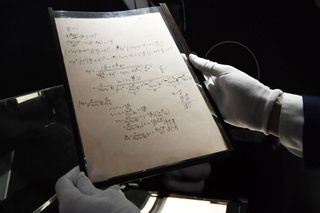 A picture taken on November 22, 2021 shows pages of one of the preparatory manuscript to the theory of general relativity of Albert Einstein, during their presention a day before being auctionned at Christie's auction house in Paris.