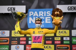 Team Education First rider Switzerlands Stefan Bissegger celebrates his overall leader yellow jersey on the podium after winning the 3rd stage of the 79th Paris Nice cycling race a 144km individual timetrial from Gien to Gien on March 9 2021 Photo by AnneChristine POUJOULAT AFP Photo by ANNECHRISTINE POUJOULATAFP via Getty Images
