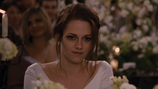 Kristen Stewart as Bella Swan listening to speeches at wedding in Breaking Dawn Part 1
