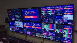 A control room with colorful monitors for digital signage used at the Special Olympics USA Games.