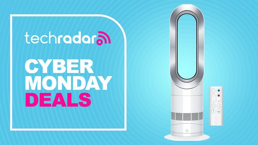 The Dyson AM09 fan heater is pictured alongside its remote. To the left, text reads: TechRadar Cyber Monday deals.