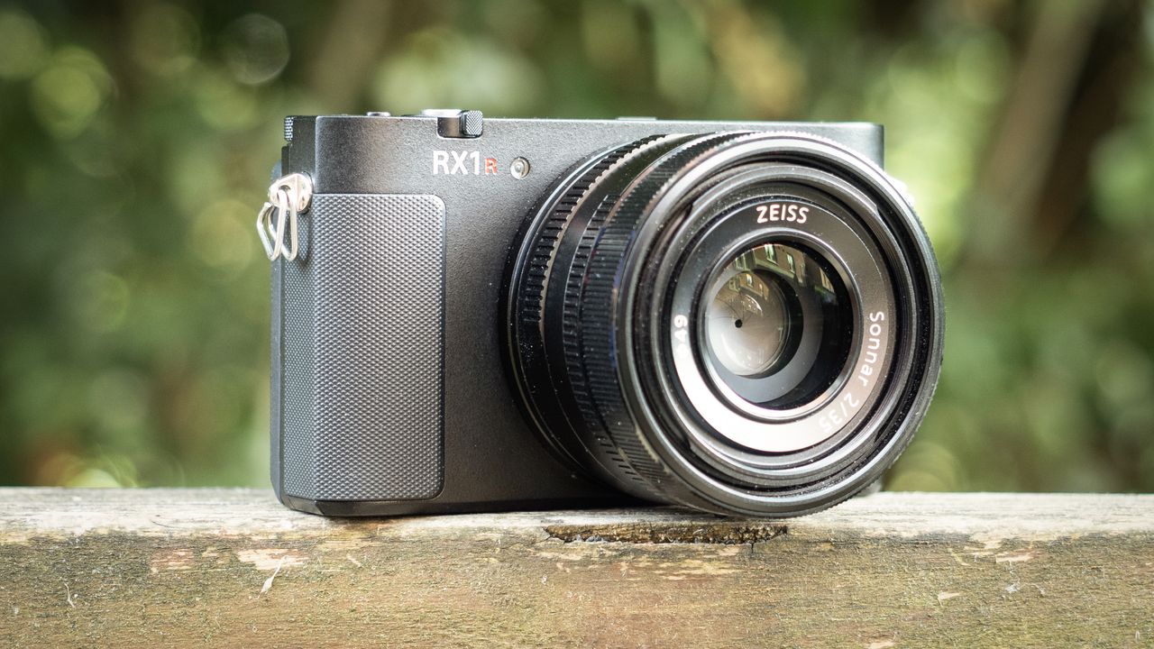 Sony RX1R III on a wooden surface in a woodland environment