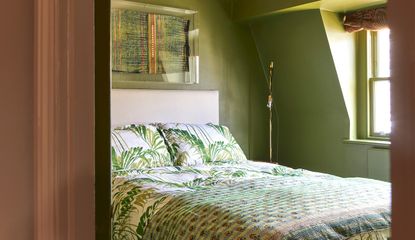 A small bedroom with color drenched walls