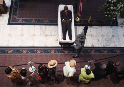 Mourners file past the body of Clementa Pinckney.