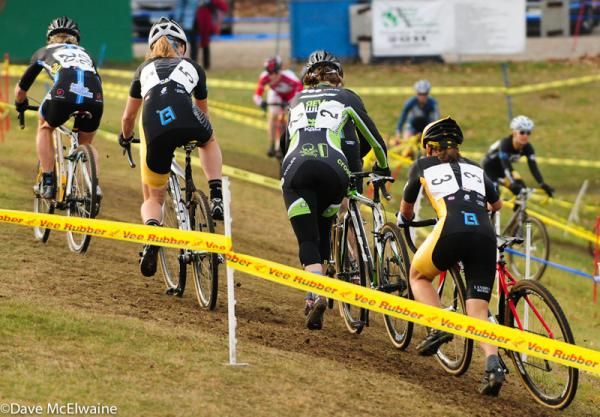 The leaders re-mount on an off-camber section of the course