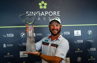 Ockie Strydom with Singapore Classic trophy