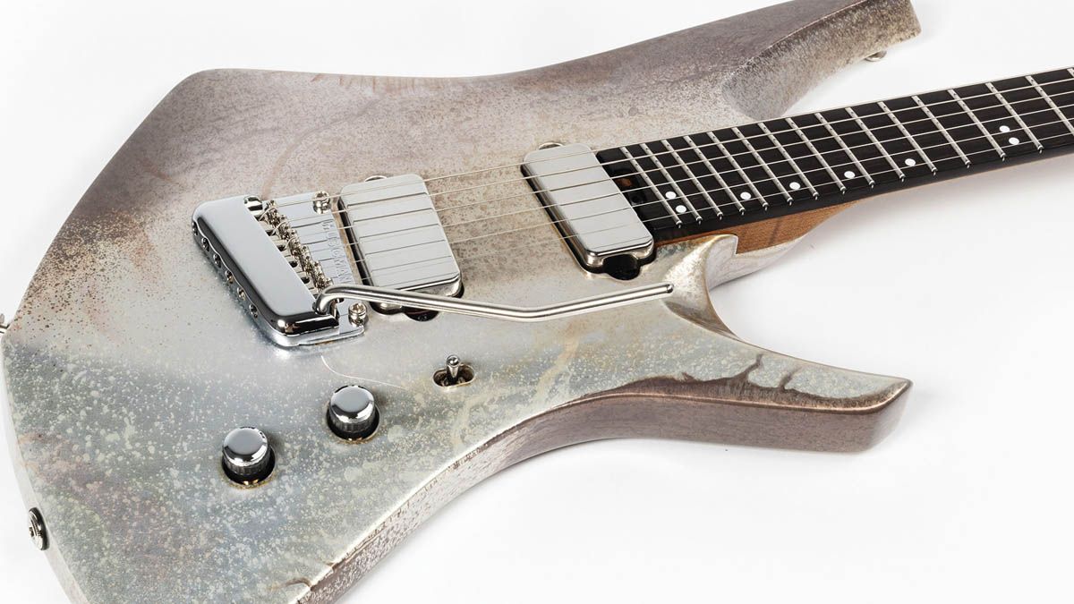 The Ernie Ball Music Man Kaizen Gallium has a custom aged metallic finish, making Tosin Abasi's signature electric guitar look like an alien artefact