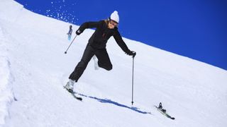 A man ejects from his ski on the way downhill