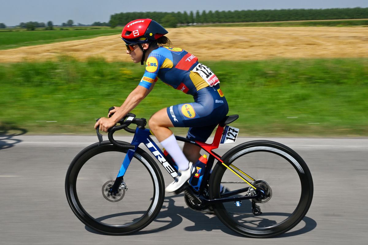 Talented young climber Gaia Realini on the way back from a rear wheel change