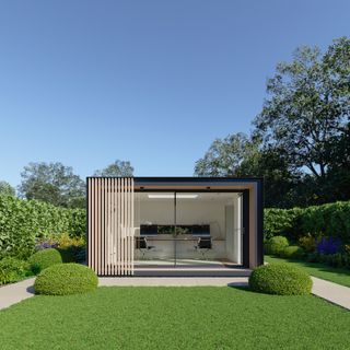 modern garden office in a simple modern garden with a large lawn