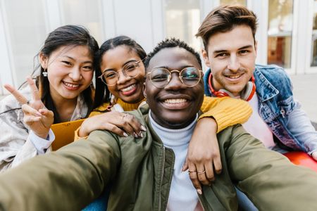 Four college-age people in a group