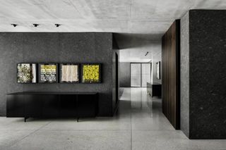 Concrete walls in an open space with a desk