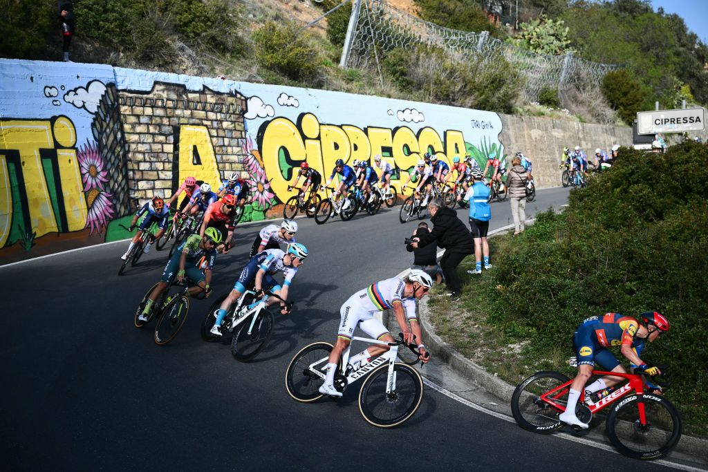 van der Alpecin-Deceuninck's Dutch rider Mathieu Van der Poel (2nd R) and Lidl-Trek's Lativian rider Toms Skujins (R) ride through the Cipressa during the 115th Milan-SanRemo one-day classic cycling race, between Pavia and SanRemo, on March 16, 2024. (Photo by Marco BERTORELLO / AFP)