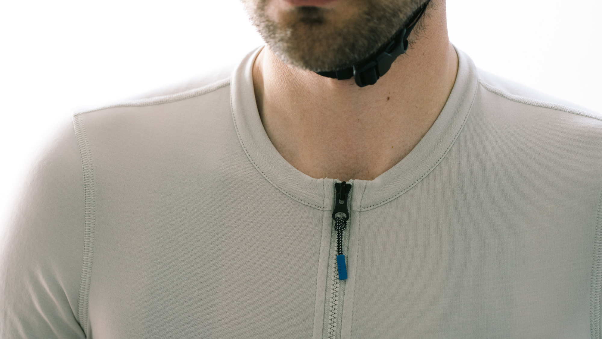 Maap Alt_Road jersey worn by a man against a white wall