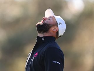 Jon Rahm reacting at a LIV Golf event