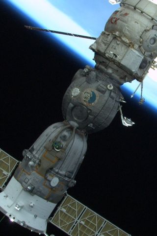 The image of Russian cosmonaut Yuri Gagarin is seen emblazoned on the side of a Russian Soyuz spacecraft in this photo taken by Endeavour shuttle astronaut Mike Fincke while working outside the International Space Station during a spacewalk on May 27, 201