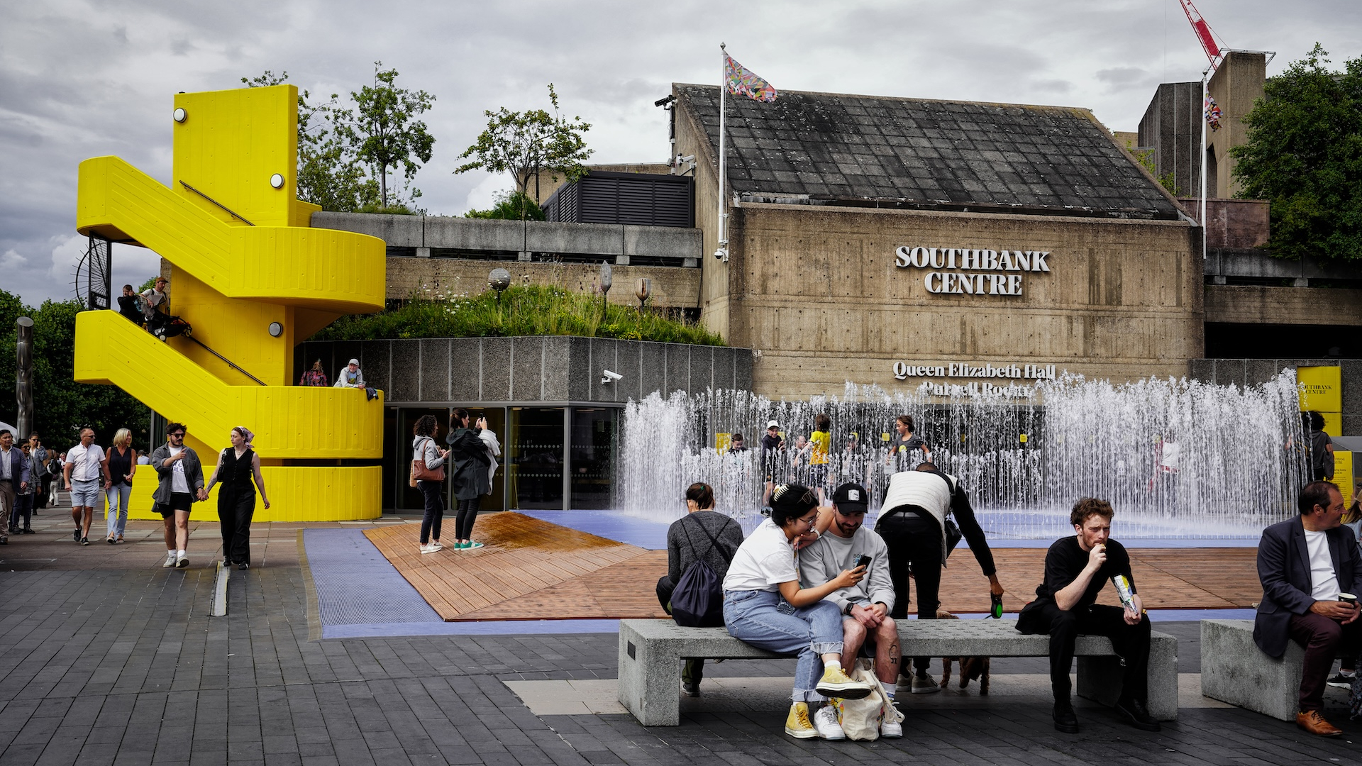 On July 12, 2024: London cultural venue; riverside view: Water Activities and Art at Southbank Centre Terrace. visitors engage in water activities, at Queen Elizabeth Hall.leisure activities and cultural attractions, a dynamic cultural hub in London - both locals and tourists alike with its blend of entertainment, art, and scenic riverside views, visitors Strolling along the River Thames, Riverside Walks, and Southbank Centre.