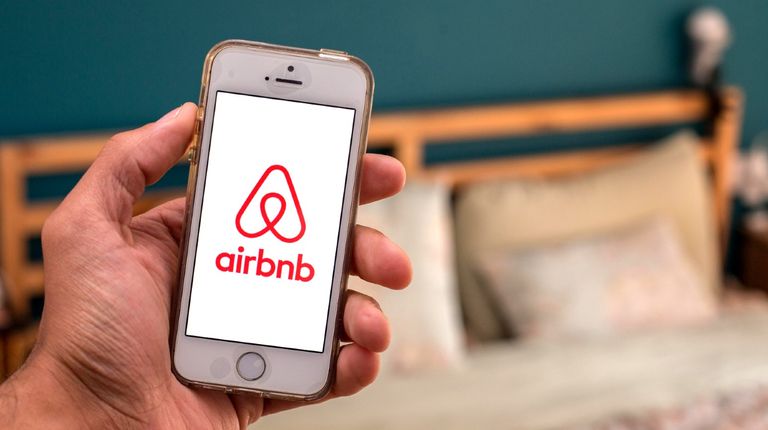 In this photo illustration, the Airbnb app seen displayed on a smartphone screen.