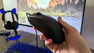 The Razer DeathAdder V3 in hand, seen from the top and side.
