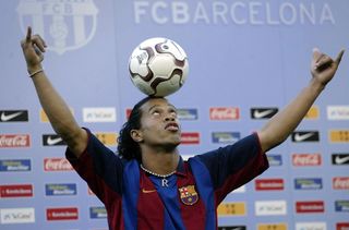 Ronaldinho shows off his skills during his official presentation as a Barcelona player at Camp Nou in July 2003.