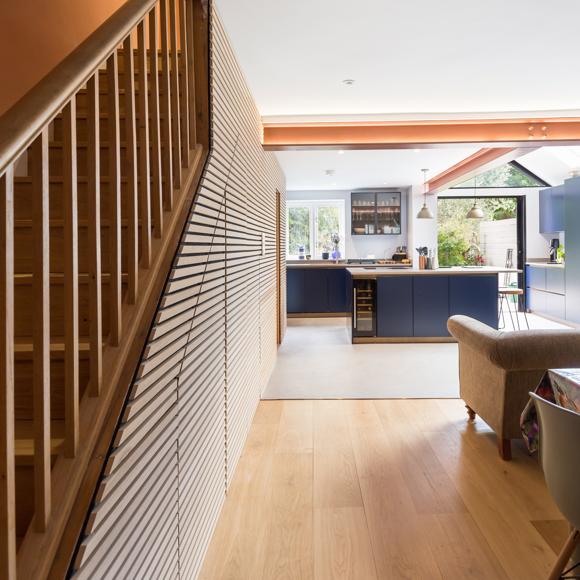 view beside the stairs into the large open plan kitchen diner