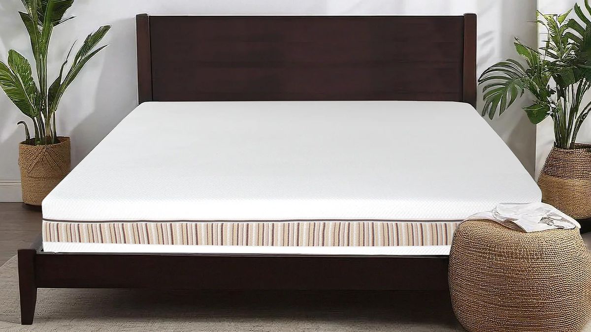 The Essentia Venti Organic Latex Double Sided Mattress on a bed frame in a bedroom