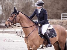 Riding wearing Ariat riding boots