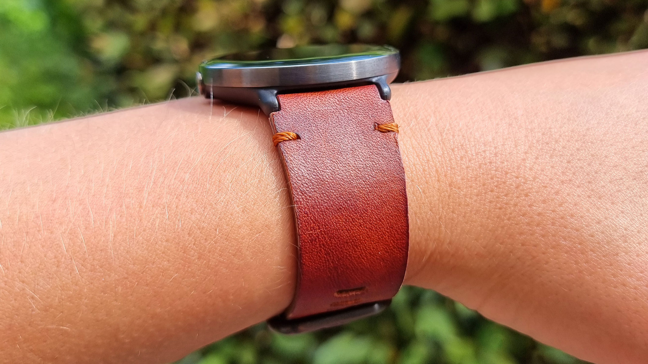 The Polar Ignite 3 Titanium being worn on the wrist, view from the side