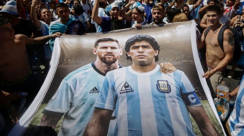 Argentina fans hold a banner with images of Lionel Messi and Diego Maradona during celebrations of their 2022 World Cup win in Buenos Aires in December 2022.