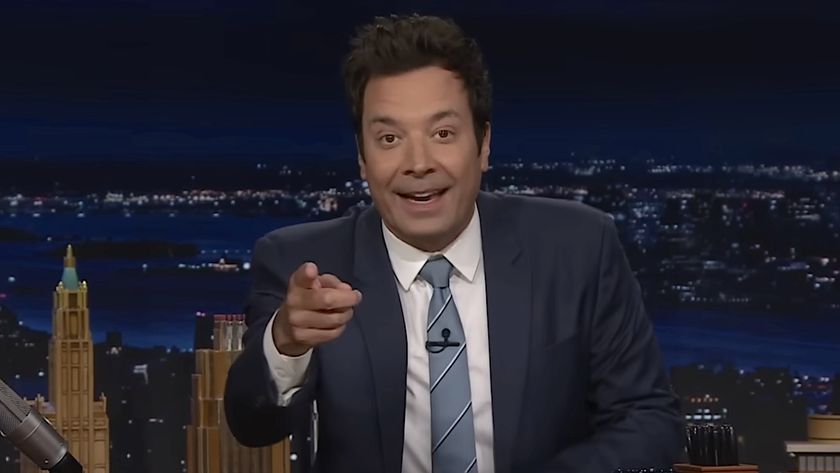 Jimmy Fallon smiling and pointing directly into the camera in The Tonight Show