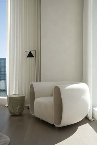 curved armchair in apartment interior