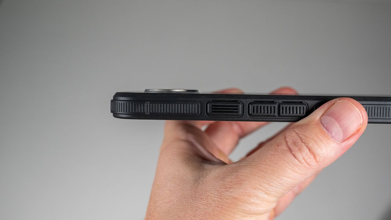 A Dbrand Ghost 2.0 case on a white Google Pixel 10 Pro XL