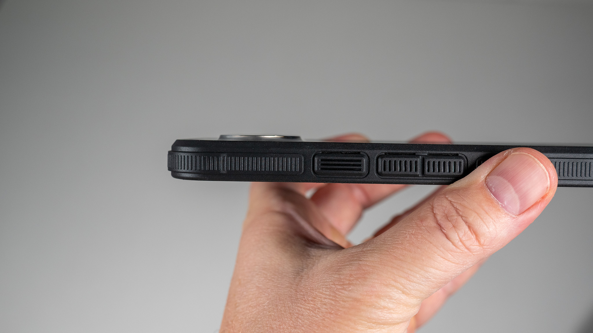A Dbrand Ghost 2.0 case on a white Google Pixel 10 Pro XL