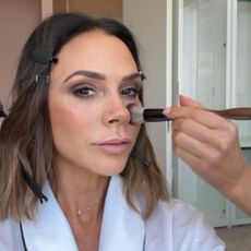 @victoriabeckham having her eye shadow applied by a MUA