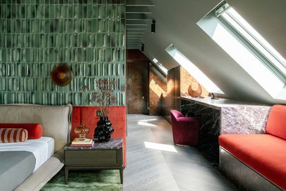 green bedroom with shiny tiles and marble surfaces