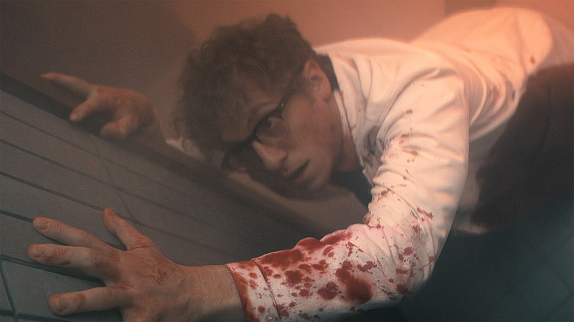 Thomas Godolkin reaching for a fire alarm in Gen V season 2 episode 1