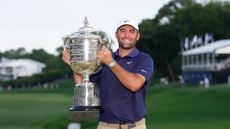 Scottie Scheffler holds up the Wanamaker Trophy after winning the 2025 PGA Championship
