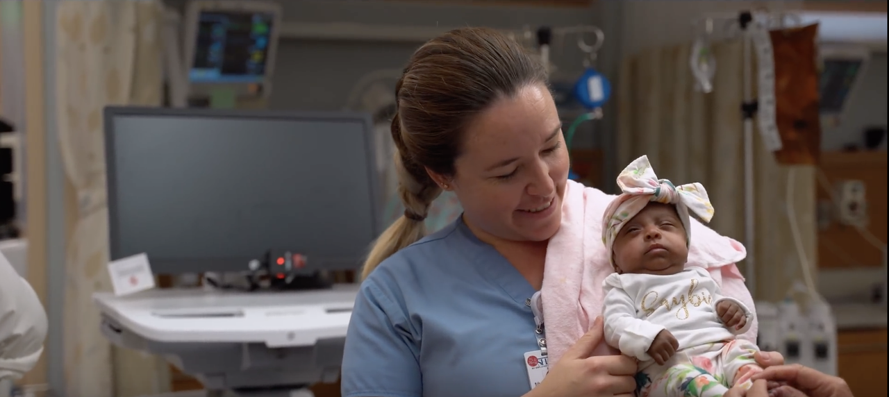 Baby Saybie and one of her nurses.