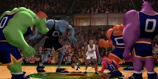 Michael Jordan, center with referee Martin Martian, faces off against the Monstars in Space Jam