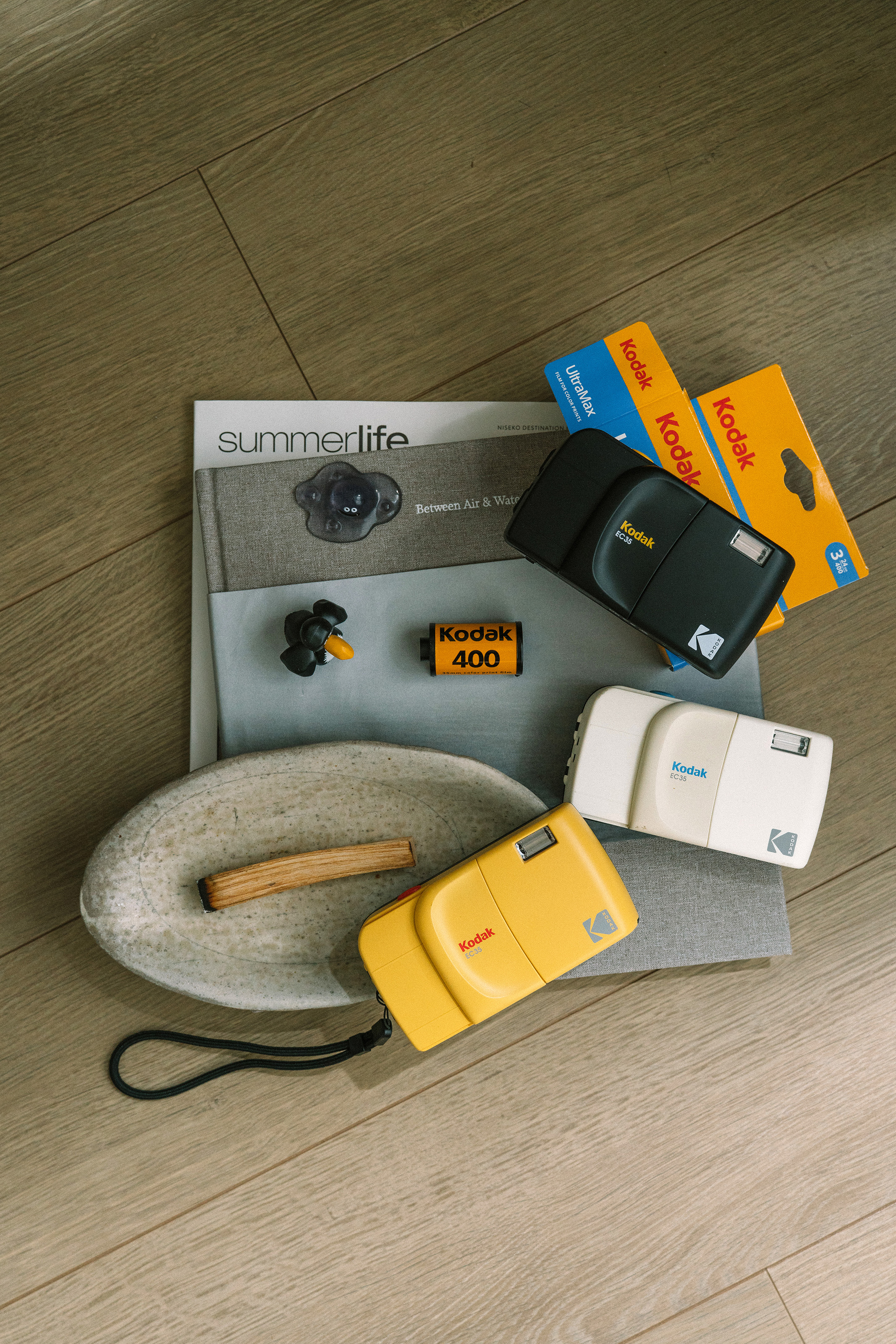 The Kodak EC35 in three colors with books and film