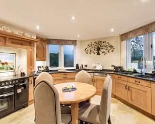 kitchen with granite worktop and wooden cabinets