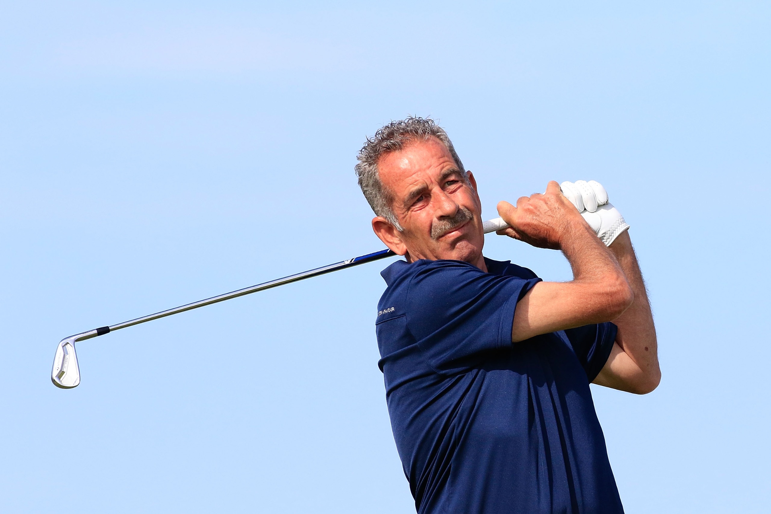 Sam Torrance holds his finish on an iron shot