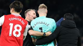 Arsenal's Aaron Ramsdale is pulled away to celebrate the Gunners' win at Tottenham following an altercation with a Spurs fan at the end of the north London derby.
