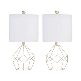 Two gold geometric lamps with white lampshades