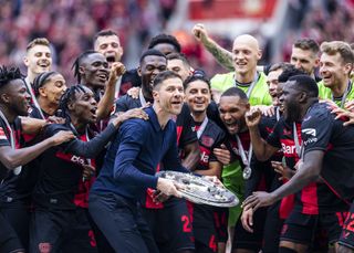 Xabi Alonso and his Bayer Leverkusen players celebrate their Bundesliga title triumph in May 2024.