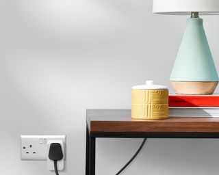 Amazon smart plug in situ with a lamp and table