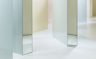 Close up of angled walls with mirrored ends