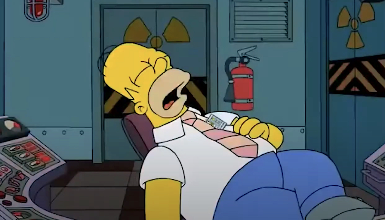 Screenshot of Homer sleeping in his chair at the power plant in The Simpsons