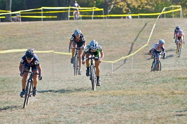 Laura Van Gilder powers away from Katie Antonneau and Ashley James in the sprint for second, while Sue Butler dismounts with a jammed drivetrain.