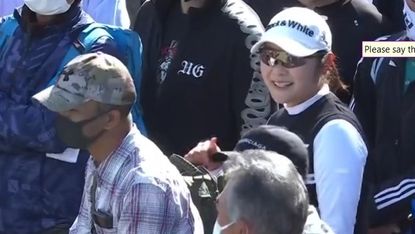 Saiki Fujita discovers her ball has landed in a spectator's backpack at the 2022 Toto Japan Classic